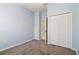 Comfortable bedroom with neutral walls, carpet flooring, closet and natural lighting at 5227 Aqua Breeze Dr, Bradenton, FL 34208