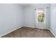 Neutral bedroom with plush carpet, natural light, and airy ambiance at 5227 Aqua Breeze Dr, Bradenton, FL 34208