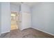 Bright bedroom with neutral walls, carpet flooring, closet, and doorway access to a bathroom at 5227 Aqua Breeze Dr, Bradenton, FL 34208