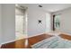 Neutral bedroom with hardwood floors, ensuite bath, and a large window for natural light at 5227 Aqua Breeze Dr, Bradenton, FL 34208