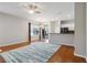 Open-concept living room featuring hardwood floors, neutral paint, and large windows for natural light at 5227 Aqua Breeze Dr, Bradenton, FL 34208