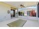 Enclosed patio area with a ceiling fan and an outdoor rug at 5227 Aqua Breeze Dr, Bradenton, FL 34208