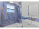 Modern bathroom featuring blue marbled tile, gold fixtures, and updated vanity at 532 Yale Rd, Venice, FL 34293
