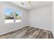 Bright bedroom features a large window and plank flooring at 532 Yale Rd, Venice, FL 34293