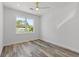 Bright bedroom features a large window and plank flooring at 532 Yale Rd, Venice, FL 34293