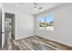 Bright bedroom with plank flooring, and a view to other rooms at 532 Yale Rd, Venice, FL 34293