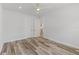 Bright bedroom with plank flooring, featuring a view to other rooms at 532 Yale Rd, Venice, FL 34293