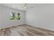 Bright bedroom features a large window and plank flooring at 532 Yale Rd, Venice, FL 34293