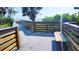 Beach boardwalk with railings and built-in bench overlooking the ocean at 532 Yale Rd, Venice, FL 34293