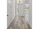 Bright foyer featuring sleek floors, white walls, and a glass-paneled front door at 532 Yale Rd, Venice, FL 34293