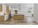 Well-lit kitchen featuring white cabinets, a stylish island, and stainless steel appliances at 532 Yale Rd, Venice, FL 34293