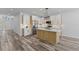 Bright, modern kitchen with an island, stainless steel appliances, and ample storage space at 532 Yale Rd, Venice, FL 34293