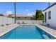 Backyard pool with brick patio and fence, with lounge chairs at 532 Yale Rd, Venice, FL 34293