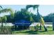 Sign for South Venice Beach Ferry, surrounded by lush tropical foliage at 532 Yale Rd, Venice, FL 34293