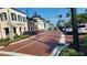 Charming street view of a community featuring retail buildings and palm trees at 532 Yale Rd, Venice, FL 34293