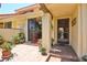 Charming courtyard with brick pavers, potted plants, and a covered entrance at 5362 Huntingwood Ct # 16, Sarasota, FL 34235