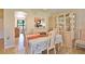 Dining area with tile flooring, adjacent to a kitchen pass-through, and natural light at 5362 Huntingwood Ct # 16, Sarasota, FL 34235