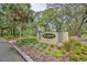 Elegant entrance to The Meadows Country Club, enhanced by meticulously kept landscaping and a welcoming atmosphere at 5362 Huntingwood Ct # 16, Sarasota, FL 34235