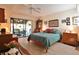 Bright main bedroom with a ceiling fan, a sliding glass door, and tile floors at 5362 Huntingwood Ct # 16, Sarasota, FL 34235