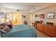 Comfortable main bedroom featuring a ceiling fan, tile floors, and ample closet space at 5362 Huntingwood Ct # 16, Sarasota, FL 34235