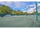 Well-maintained tennis courts with lighting and ample space for recreational play at 5362 Huntingwood Ct # 16, Sarasota, FL 34235