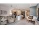 A spacious open-concept living room with a view of the kitchen and featuring tile flooring at 5889 Biscotti St, Nokomis, FL 34275