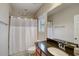 Clean, cozy bathroom with a granite vanity, modern fixtures, and shower at 6001 Anise Dr, Sarasota, FL 34238