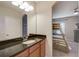 Bathroom with granite countertop, leading to a bedroom featuring a bunk bed set at 6001 Anise Dr, Sarasota, FL 34238
