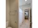 Bathroom with tile floors, open door showing a bunk bed, and a toilet at 6001 Anise Dr, Sarasota, FL 34238