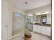 Bathroom with large glass enclosed shower and dual sink vanity at 6001 Anise Dr, Sarasota, FL 34238