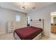 Comfortable bedroom with storage drawers in bed frame and a ceiling fan at 6001 Anise Dr, Sarasota, FL 34238