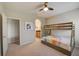 Bedroom featuring a bunk bed and ensuite bathroom at 6001 Anise Dr, Sarasota, FL 34238