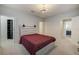 Cozy bedroom featuring a stylish bed frame and bedside lamps at 6001 Anise Dr, Sarasota, FL 34238