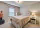 Bedroom with carpet, bed, nightstand and chest of drawers at 6001 Anise Dr, Sarasota, FL 34238