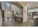 Open-concept living with foyer leading to kitchen featuring stainless steel appliances at 6001 Anise Dr, Sarasota, FL 34238