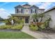 Inviting front entrance with vibrant landscaping and a well-maintained walkway at 6001 Anise Dr, Sarasota, FL 34238