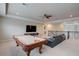 Spacious game room with a pool table, large television, and comfortable seating area at 6001 Anise Dr, Sarasota, FL 34238