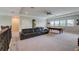 Bright game room with pool table, sofa, and natural light from multiple windows at 6001 Anise Dr, Sarasota, FL 34238
