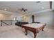 Inviting game room featuring a pool table and a comfortable seating area at 6001 Anise Dr, Sarasota, FL 34238