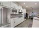 Well-equipped kitchen with stainless steel appliances, white cabinets, and granite countertops at 6001 Anise Dr, Sarasota, FL 34238