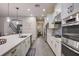Spacious kitchen featuring a large island with seating, modern appliances, and an open layout at 6001 Anise Dr, Sarasota, FL 34238