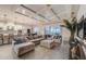Spacious living room featuring coffered ceiling, a large sectional sofa, and a view to the backyard at 6001 Anise Dr, Sarasota, FL 34238