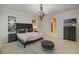 Bedroom with a wood chandelier, dark furniture, wood-look tile floors at 6001 Anise Dr, Sarasota, FL 34238