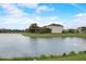 The backyard overlooks a serene pond, providing a peaceful and private setting at 6001 Anise Dr, Sarasota, FL 34238