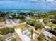 Expansive aerial view showcasing the home nestled in a vibrant waterfront community at 612 Shore Rd, Nokomis, FL 34275