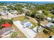 Aerial view showcasing a quaint neighborhood with well-maintained homes and picturesque surroundings at 612 Shore Rd, Nokomis, FL 34275