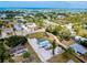 Aerial view capturing the home's location within a lush community near the water at 612 Shore Rd, Nokomis, FL 34275
