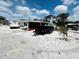 View of a trailer in the back yard at 612 Shore Rd, Nokomis, FL 34275
