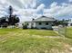Backyard with chainlink fence and grass at 612 Shore Rd, Nokomis, FL 34275
