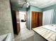 Tiled bathroom featuring a new vanity, floors, and closet doors at 612 Shore Rd, Nokomis, FL 34275